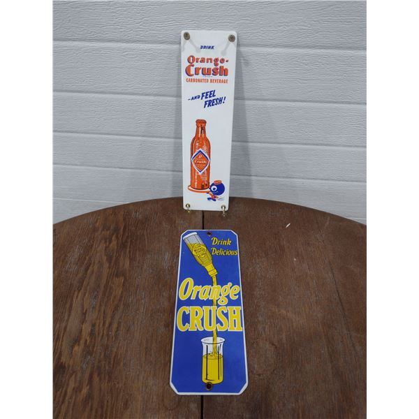 2 smaller orange crush enamel signs
