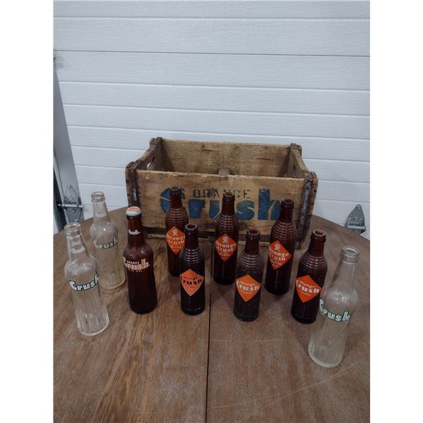 10 assorted orange crush bottles with orange crush crate