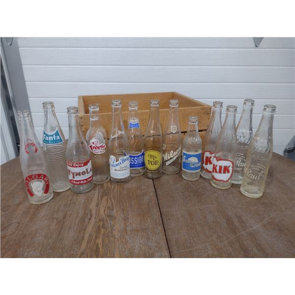 13 obscure pop bottles with wooden crate