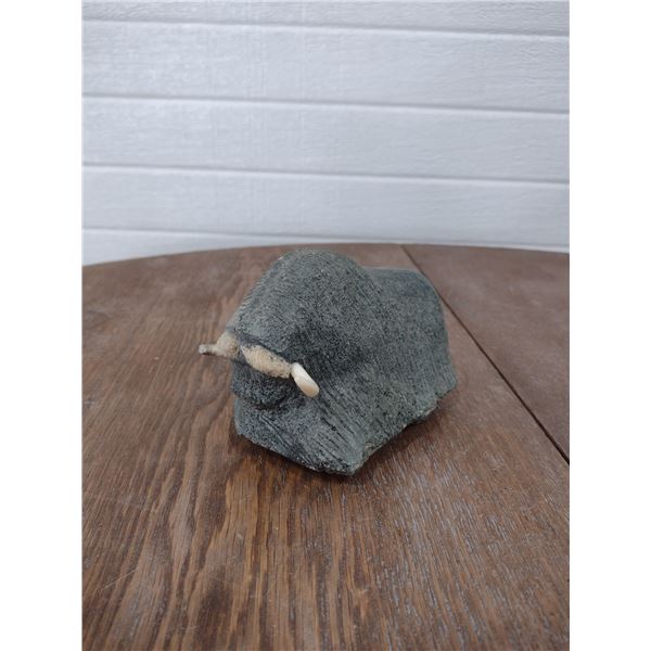 original stone carving of a musk ox