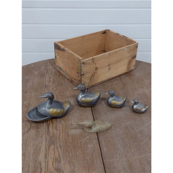 4 pewter duck trinket boxes and a carved soapstone loon
