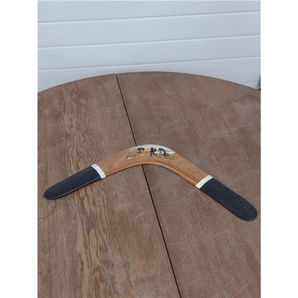Boomerang with aboriginal scene painted on it