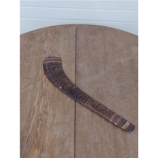 boomerang with carvings