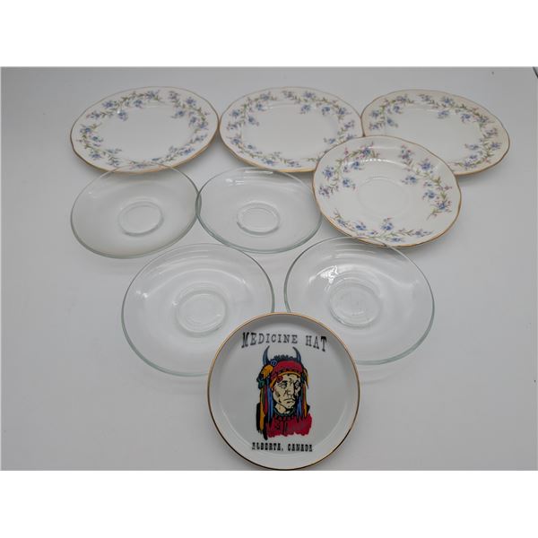 Assortment of flatware and colored glass dishes