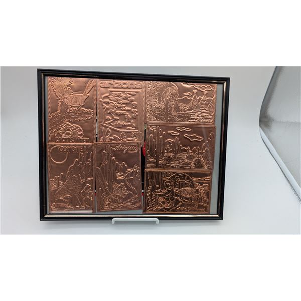 Framed picture of embossed copper postcards