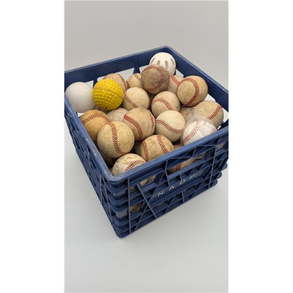 Milk crate full of Baseballs