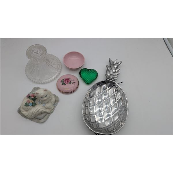 Assortment of knick-knacks and metal pineapple dish