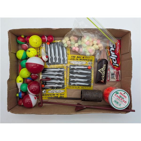 selection of bobbers, hooks, bait etc.