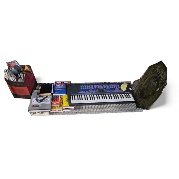 Casio CTK-451 Portable Keyboard, Brass Piece, and Assorted Books