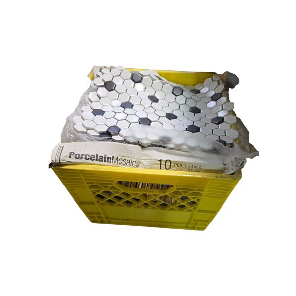 Crate full of Hex Matte White with Black Dot porcelain mosaic tile.
