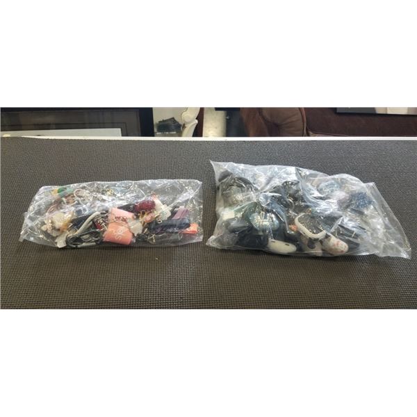 LARGE ASSORTMENT OF KEYCHAINS, AND BAG OF AIRPOD PROTECTIVE CASES