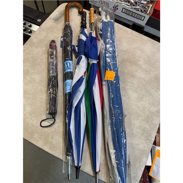 Four Rain Umbrellas and One Large Beach Umbrella