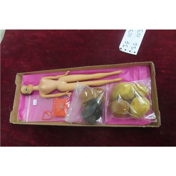 Vintage 1958 Mattel Barbie Doll, Made in Japan, With Five Wigs and a Purse.