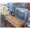 Image 1 : Table of items including televisions, cot, bench