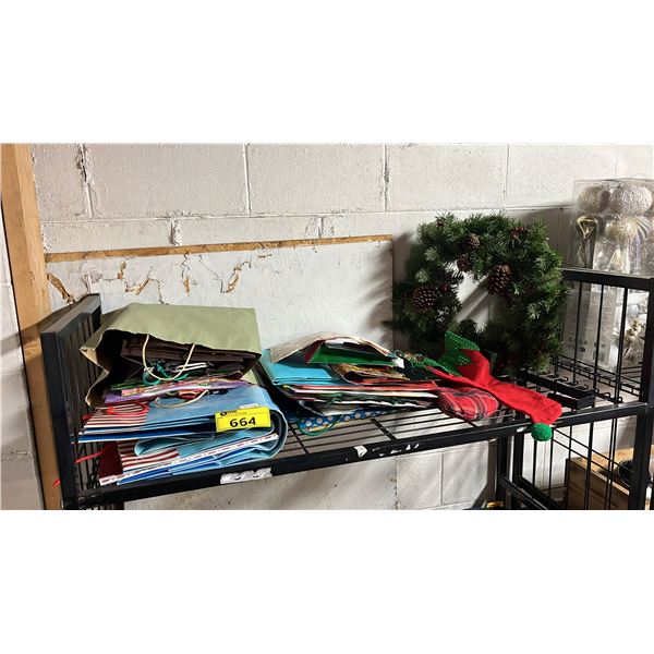 SHELF OF GIFT BAGS & A CHRISTMAS WREATH