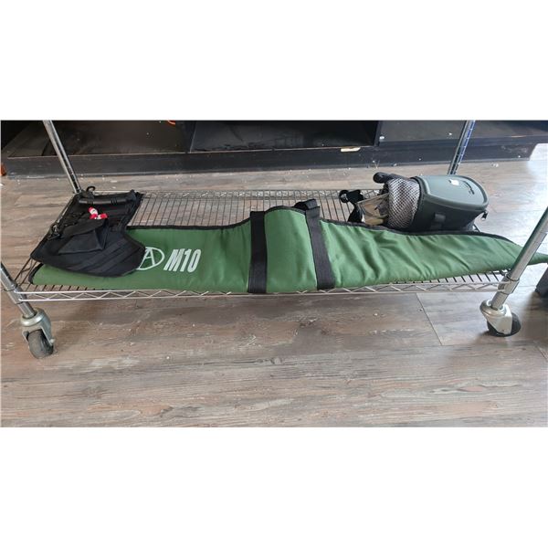 SHELF OF ASSORTED ITEMS INCLUDING; SOFT RIFLE CASE, GALLEN GUN SUPPLY CASE & CHRISTMAS STOCKING