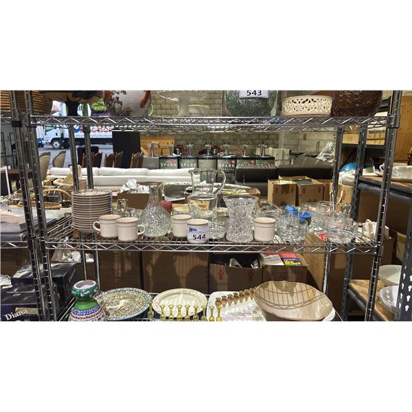 SHELF OF ASSORTED KITCHENWARE ITEMS - PITCHERS, GRAVY BOWL, SAUCERS, MUGS & MORE