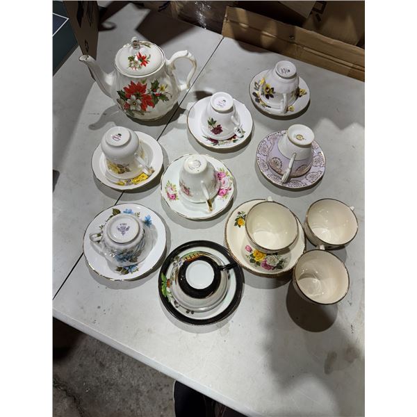 Teapot and tea, cups, and saucers