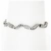 Image 1 : 18K Gold 7" 1.60 ctw Baguette Channel Set Diamond Dual Finish Wavy Link Bracelet
