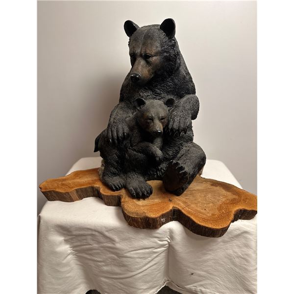 Bear statue on wood base