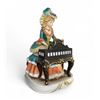 Image 1 : Melody in Motion handmade & hand-painted porcelain electric pianist modeled by Seiji Nakene - 10 1/2