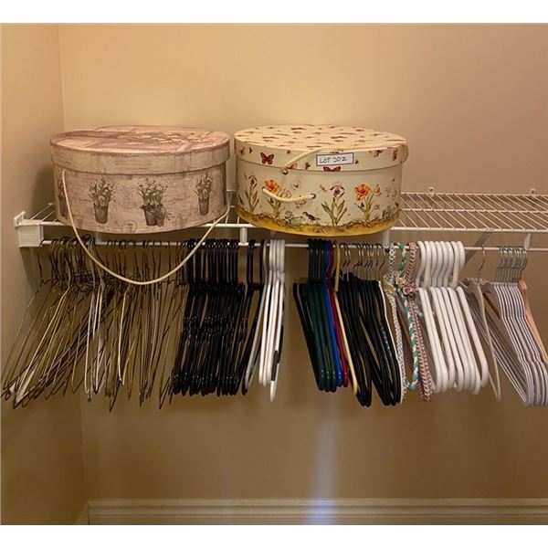 Group of clothing hangers & boxes (white racks not included)