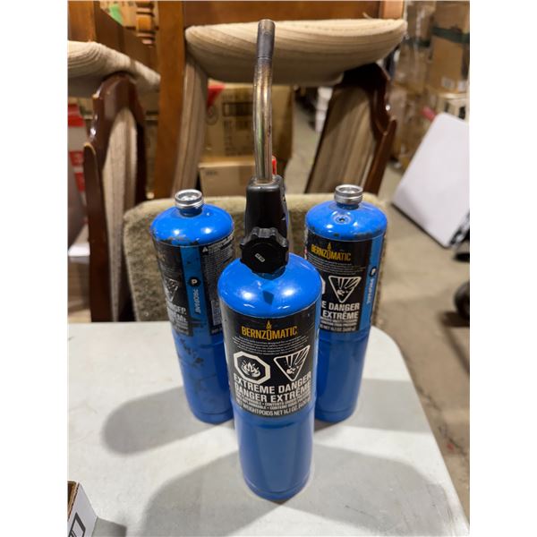 Propane bottle and two empty ones