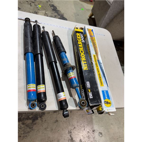 Shock observers, and struts