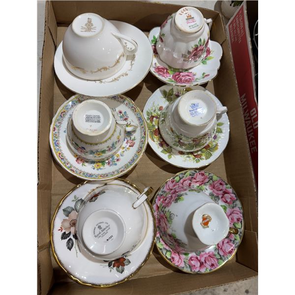 Assorted tea, cups, and saucers