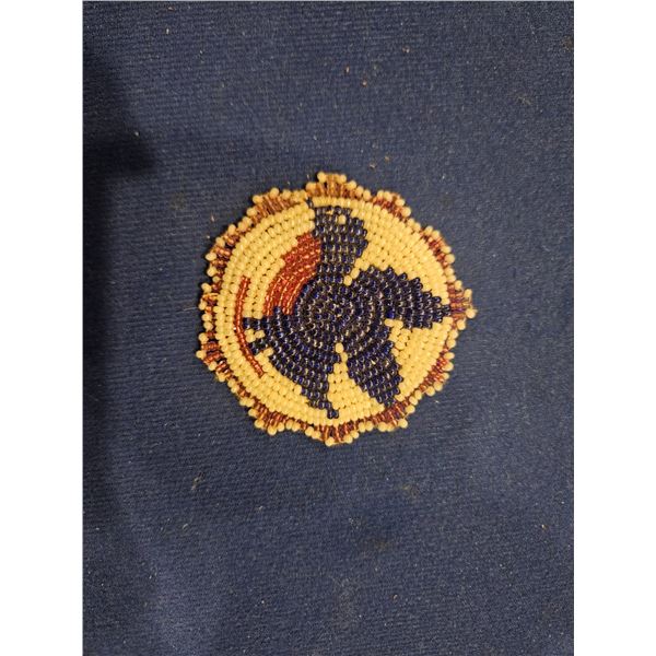 Beaded bird with leather back