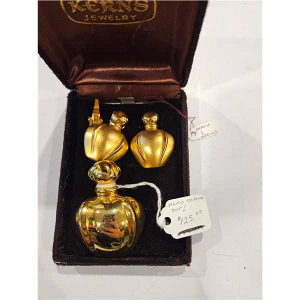 Brooch and clip on earrings (one broken on back)