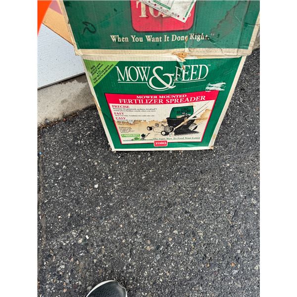 Mower mounted fertilizer spreader