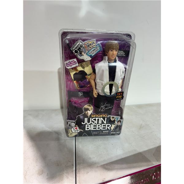Singing, Justin Bieber doll