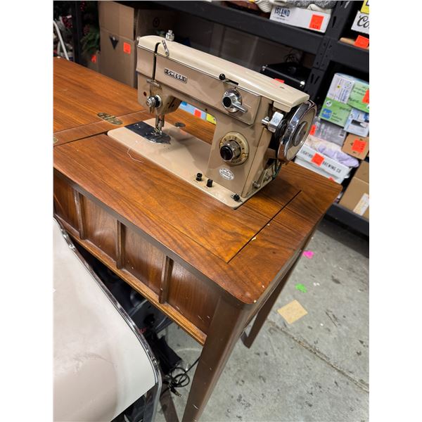 Omega, sewing machine in cabinet