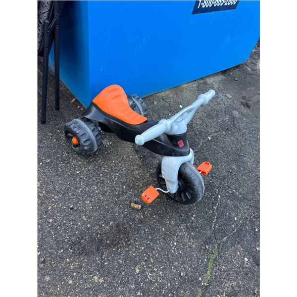 Child's ride on tricycle