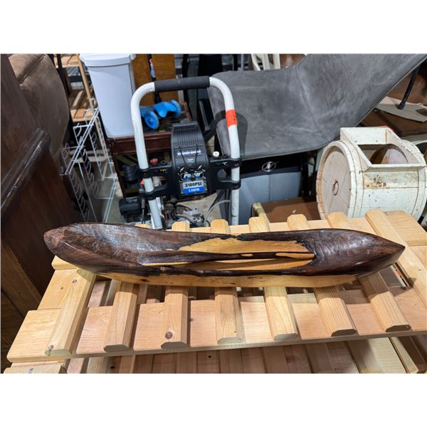 Solid wood canoe with paddle