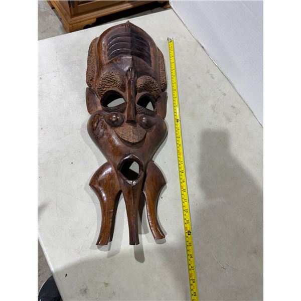 hand-carved wooden tribal African art face wall mask.