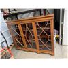 Image 2 : Display cabinet with key measures 5 feet long 15 inches deep 48 1/2 inches tall.