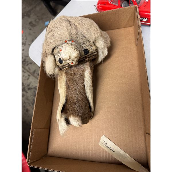 hand-carved gourd rattle, also known as a guiro or huiro