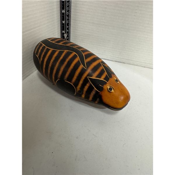hand-carved gourd rattle, also known as a guiro or huiro
