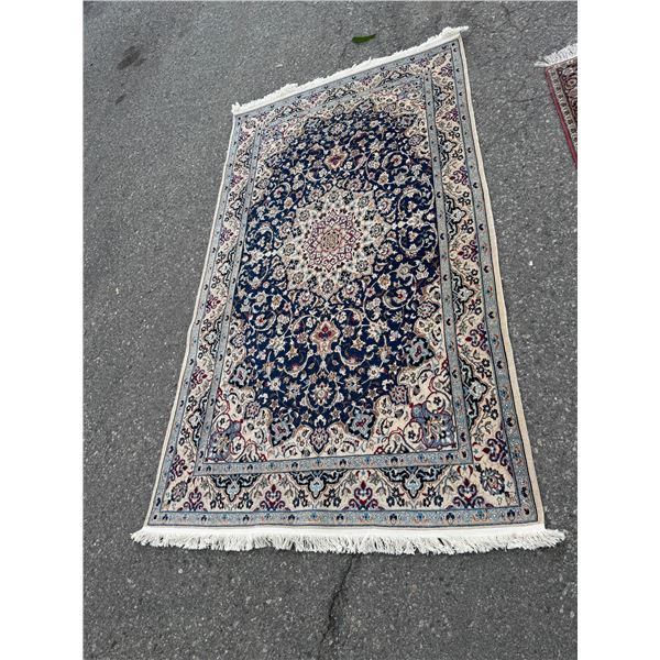 Persian rug measures 50.5 inches 88 inches