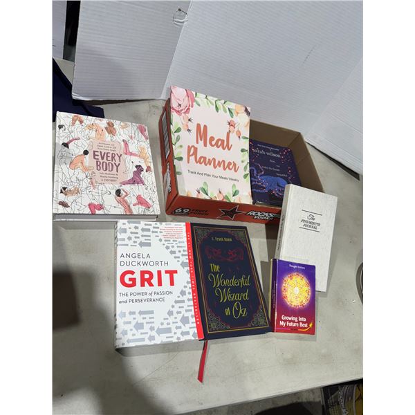 Assorted books and five minute journal