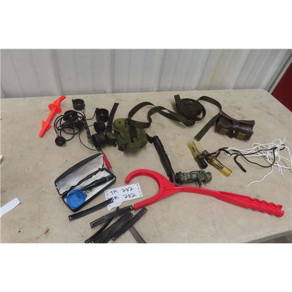 Assorted Items Including Duck Calls, Bore Light, Scope Cover, and Stripper Clips and More