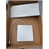 Image 1 : Apple, external hard drive and keyboard