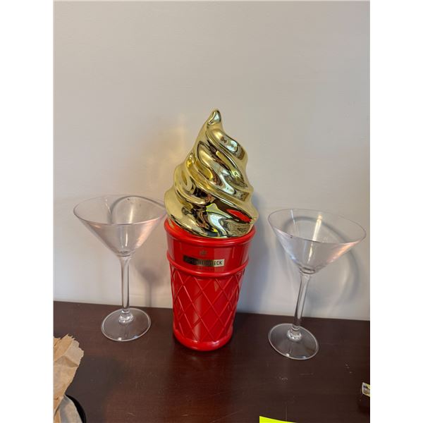 PIPER HEIDSIECK a champagne container and plastic martini glasses