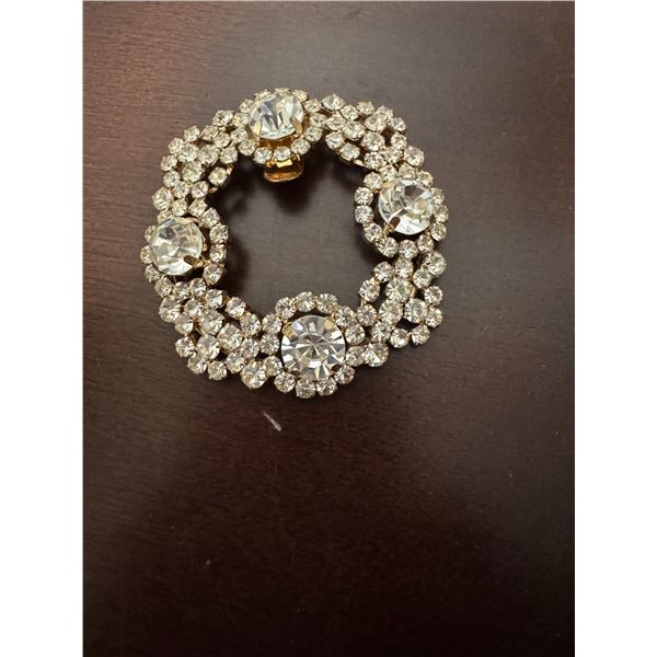 vintage rhinestone wreath brooch with a clip-on closure