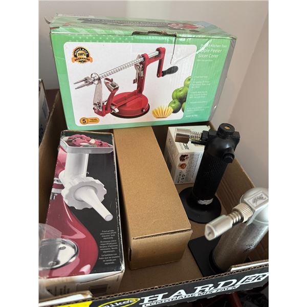 Assorted kitchen items, rice, cube, apple peeler, slicer, core, and other