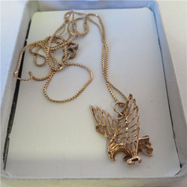 10K Yellow Gold eagle pendant and 21" chain.  Both marked 10K