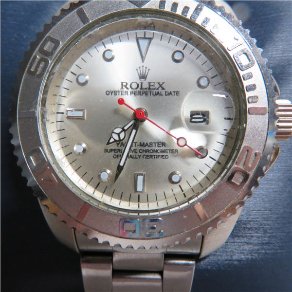 Faux ROLEX Oyster Perpetual Date watch in working condition
