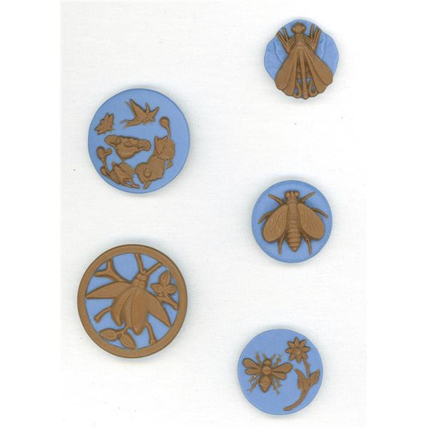 A small card of division three studio artist buttons